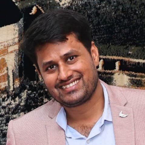 Headshot of Tanveer Ahmed.